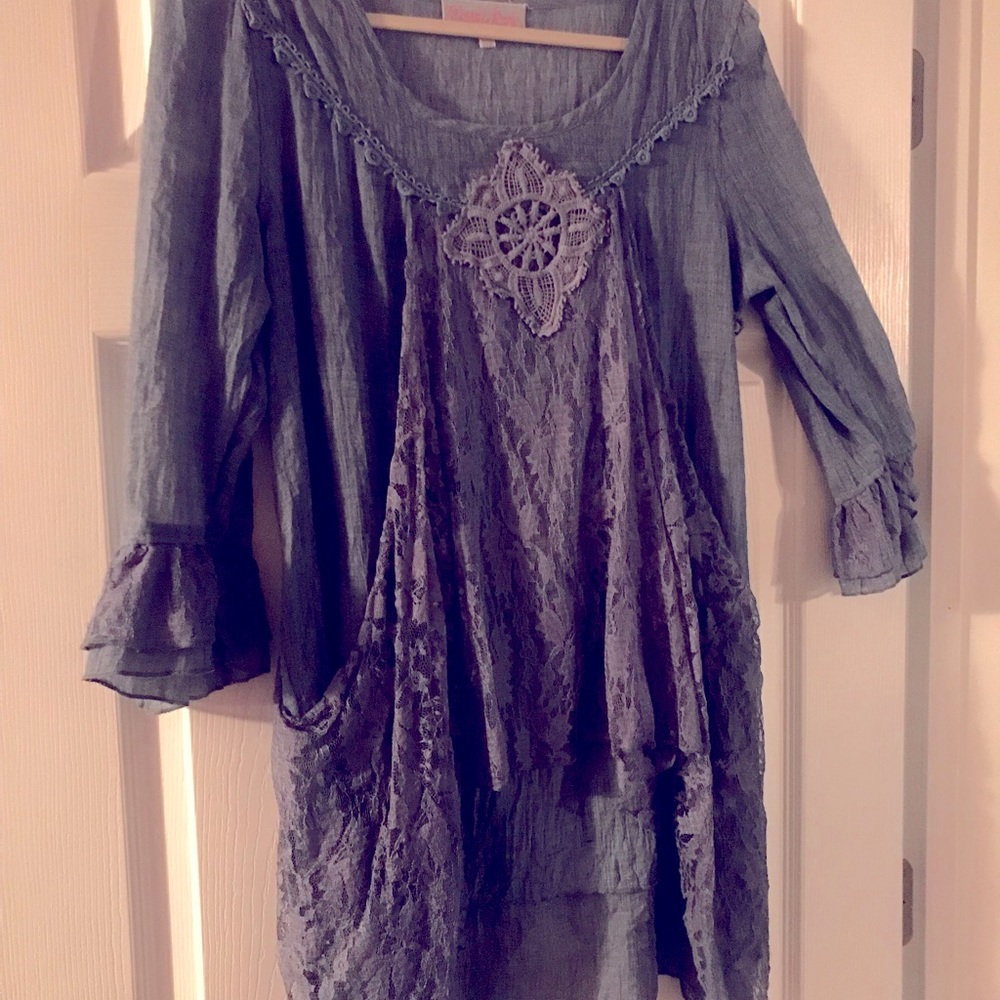 Tunic length top with cute details. Steel blue color.